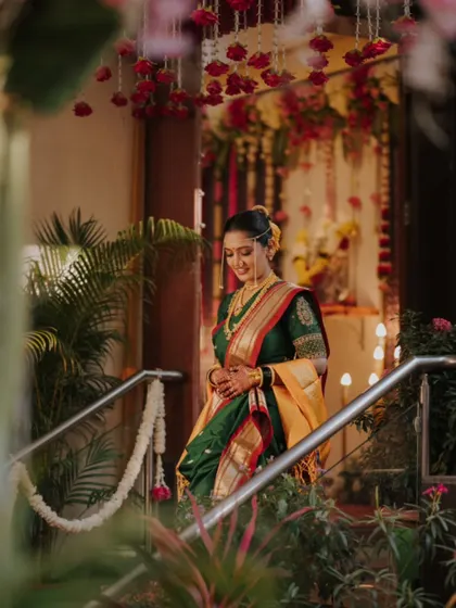 The bride's graceful entrance, captured with beautiful floral decor in the foreground.