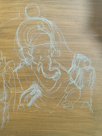 The very first step in a complex mythological painting: a light chalk sketch on a prepared canvas. This outlines the composition for a depiction of Lord Ganesha.