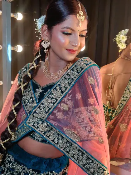 A candid shot in front of the vanity mirror, capturing the studio vibe.