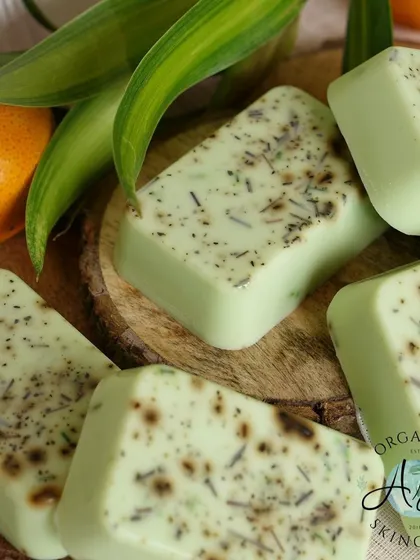 A beautiful flat-lay of my 'Green Terminator' soap bars. The light green color comes from natural ingredients, and the specks are from dried lemongrass and green tea leaves.