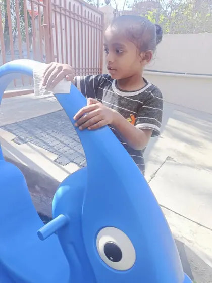 Another student taking responsibility for cleaning the play equipment. These practical life skills are an important part of our curriculum.