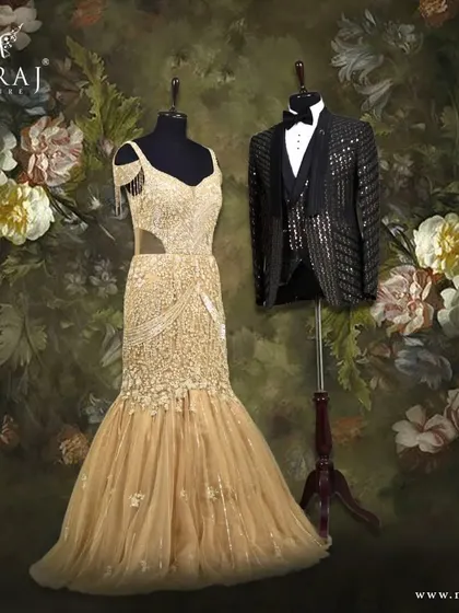 Redefining couple style with gilded gold and black. The groom's black Italian tuxedo with foil sequins adds a modern edge to the bride's sparkling off-shoulder mermaid gown.