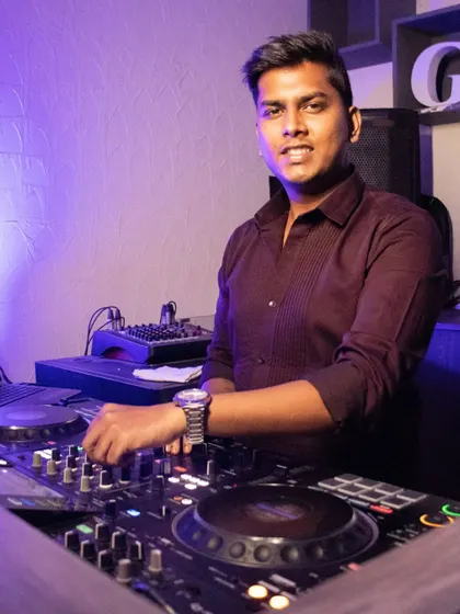 A smiling shot from behind the decks, happy to be starting a new residency.