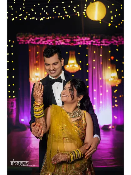 The joy in their eyes is unmistakable. A lovely portrait of a couple during their evening function, with beautiful bokeh in the background.