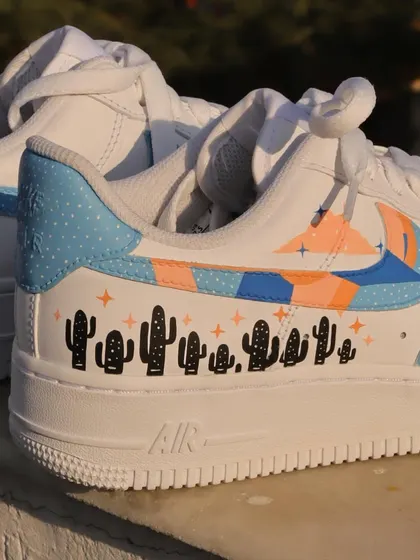 Another angle of the freehand pastel custom AF1s, showing how the different elements like the abstract swoosh and the cactus line come together.