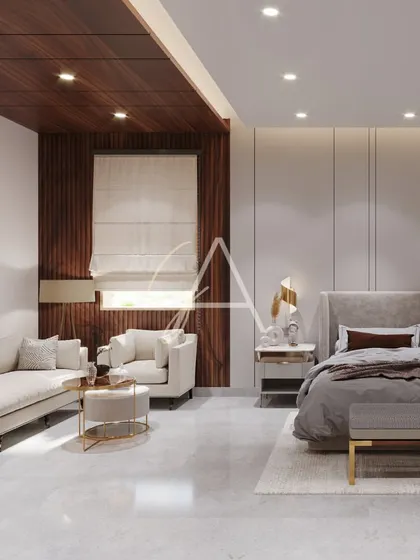 This master bedroom is large enough to include a full seating area. I used wood paneling and a coffered ceiling detail to define the lounge space, making the large room feel cozier and more intimate.