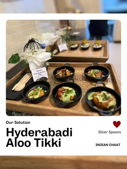 We serve our Hyderabadi Aloo Tikki in charming mini pans. The crispy potato patties are topped with yogurt and chutneys, offering a taste of authentic Indian flavors.
