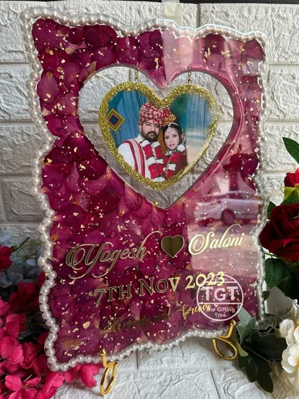 This frame comes with a stand, making it a perfect statement piece for a tabletop or shelf. The heart-shaped window is a unique and romantic touch.