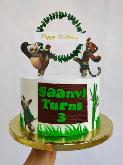 Everybody was kung fu fighting on this cake. A fun Kung Fu Panda theme for a third birthday, featuring Po and Tigress in action.