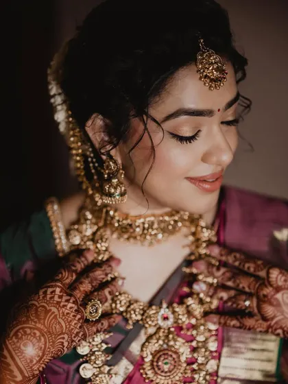 A close-up of Anushya's beautiful makeup and jewelry. The soft glam look enhances her features without overpowering them.