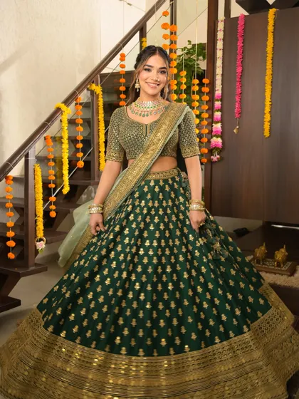 The full festive look in all its glory. The rich green lehenga and glowing makeup are a perfect match for any grand celebration.