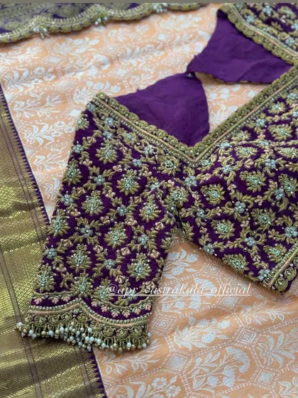 A close-up of the sleeve detail on the purple blouse.