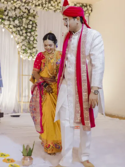 The couple walks together during their wedding ceremony, a symbolic step forward into their new life.