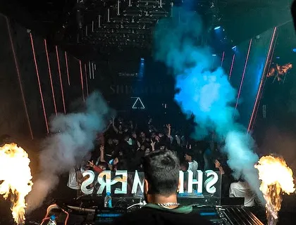 From my perspective on the decks, with fire and CO2 cannons blasting, creating an electrifying atmosphere for the audience.