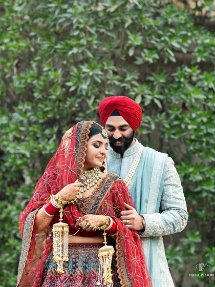 A quiet moment between Akanksha and Harshmeet. We focus on the rich colors and textures of traditional Sikh wedding attire, capturing the elegance and cultural significance of the day.