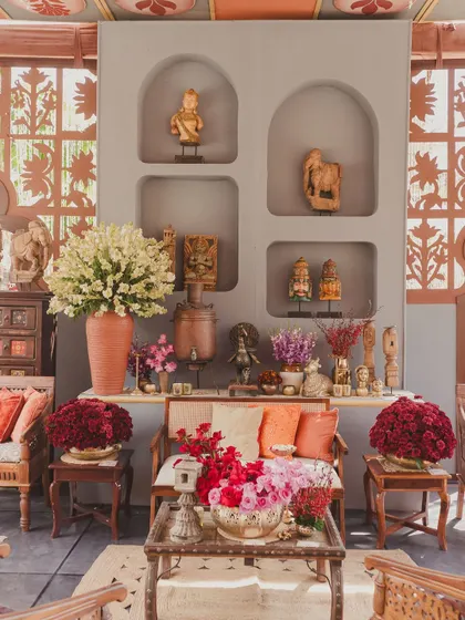 A close-up of the decor, showing how we layer vintage figurines, florals, and textiles to create a rich, story-filled environment.