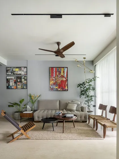 This is our own penthouse, Project 301, where we experimented with clean lines and open spaces. The living room is filled with personal art and furniture pieces that tell our story.
