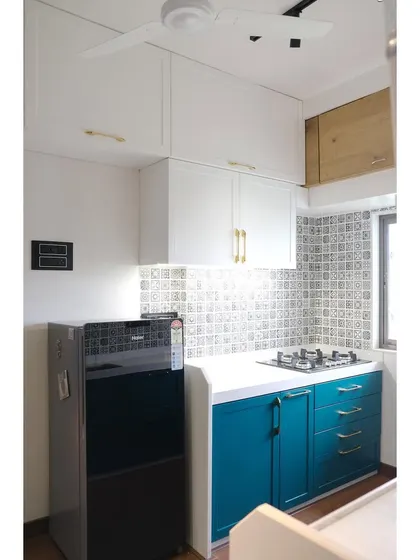 The complete view of the kitchen we designed, featuring a mix of drawers and shutter cabinets in a beautiful teal PU finish. The design balances aesthetics with practical storage, including a full set of CallistoBox drawers next to the hob.