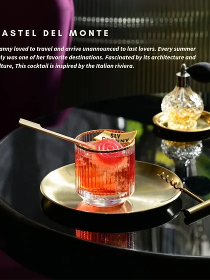 The Castel Del Monte is inspired by my summers in the Italian Riviera. This drink, with its deep red hue and cherry garnish, is a taste of European architecture and culture.