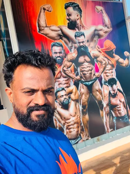 A selfie in front of the large mural at my gym. This artwork serves as daily motivation for me and my clients.