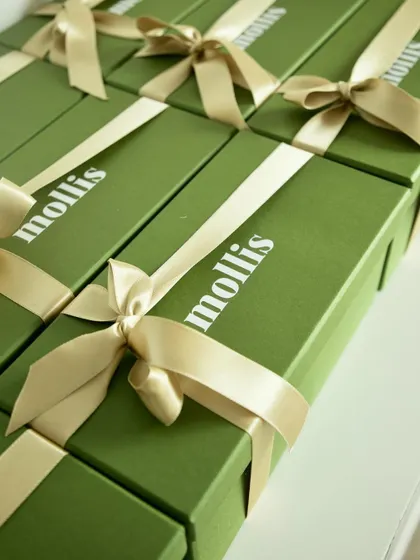 My elegant Rakhi gift box, shown here with a beautiful gold ribbon. It's a versatile gift for any sibling.