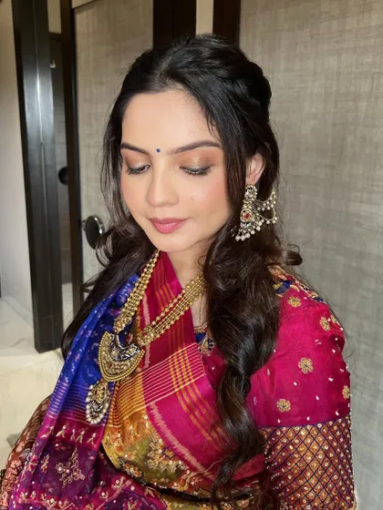 The final look for the Godh Bharai ceremony. The golden glow and minimal base make the mommy-to-be look absolutely radiant and beautiful.
