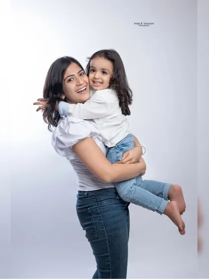 A big hug for mom! This photo radiates pure love and the special bond between a mother and her daughter.