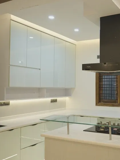 This angle shows the island with its integrated hob and the powerful chimney above. The design is perfect for those who love to cook and entertain at the same time.