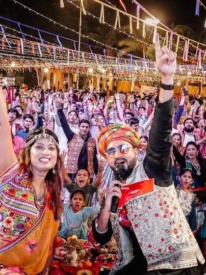 This is the view from my console. A sea of happy faces, hands in the air, completely lost in the music at a massive Raas Garba event in Ahmednagar. My goal is simple: to get every single person on their feet and create a shared moment of pure joy.