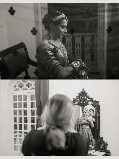 A black and white series showing the bride's final preparations, from adjusting her jewellery to a thoughtful look in the mirror, creating a timeless and elegant feel.
