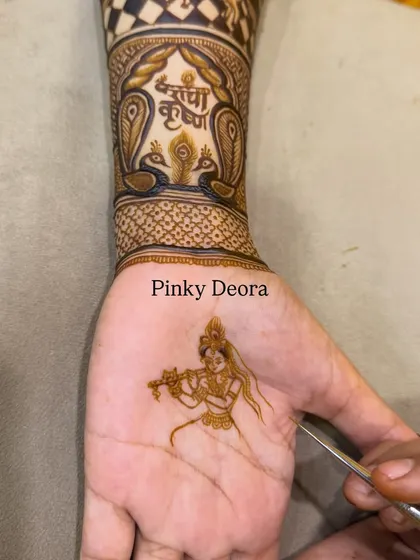 The beginning of a divine story on the palm. This image shows the delicate outline of Meera Bai, a great devotee of Krishna, playing her flute.
