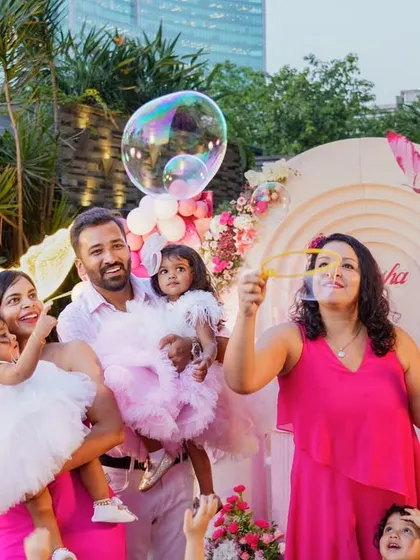 Fun with bubbles at an outdoor birthday party. We love capturing the candid joy and playful interactions between family and friends during your special events.