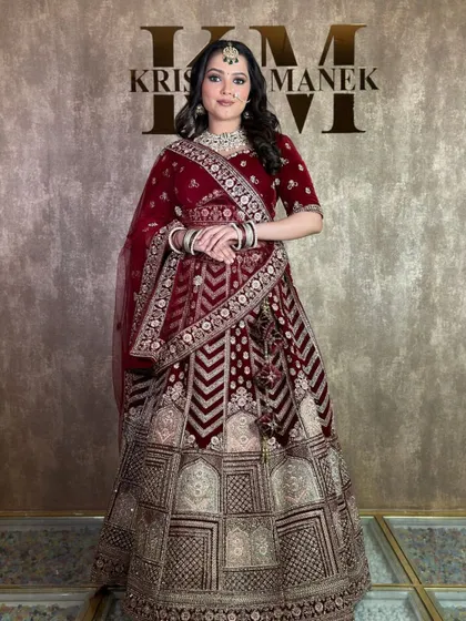 A full-length shot displaying the grandeur of the velvet lehenga with its unique geometric and floral patterns.