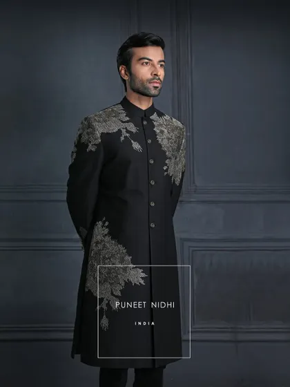 Regal yet understated, bold yet graceful. This black achkan with asymmetric floral embroidery celebrates the harmony of heritage and refinement.