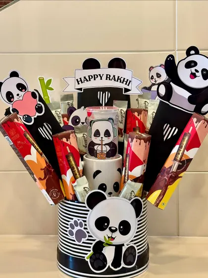 This panda-themed hamper is unbearably cute and perfect for your little animal lover. It comes with a panda mug and is filled with black and white themed treats, making it an adorable Rakhi surprise.
