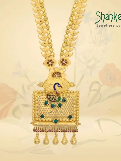 A piece of the past, crafted in gold. This long necklace features a rectangular pendant with a peacock motif, showcasing our skill in creating unique, heritage-inspired designs.