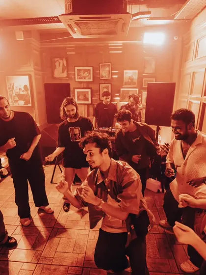 A group of friends dancing together during one of our house parties. It's a communal experience.