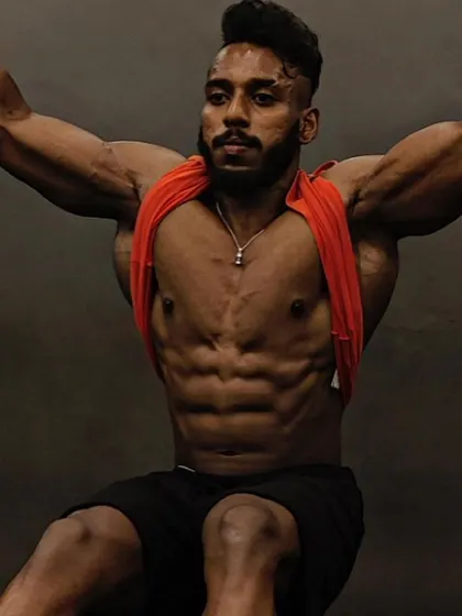 The "after" shot of a client who added significant lean mass. His shredded abs and full chest are the result of a perfect execution of my plan.