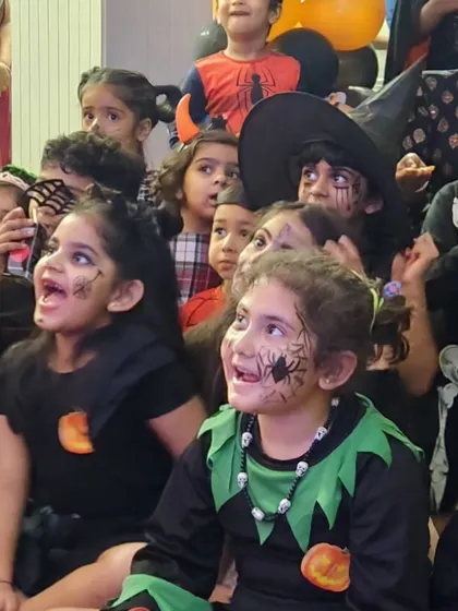 The look of pure wonder. This is the moment during a magic show when all the kids are completely captivated, their faces lit up with excitement and awe.