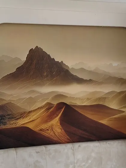 A desert mountain landscape installed within an arched wall niche. This shows how a mural can be used to create a window-like effect, adding depth to the room.