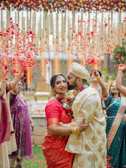 A fun and playful moment where the bride lifts the groom. We love capturing the unique personalities and humor of our couples, showing that weddings are all about joy.