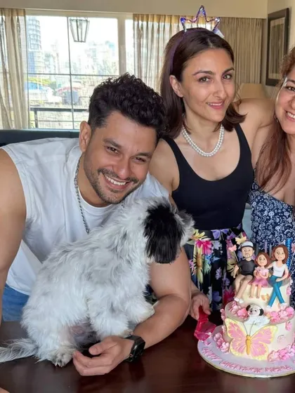A happy family moment with Soha Ali Khan and Kunal Khemu celebrating with their custom cake, complete with edible figurines of the entire family.