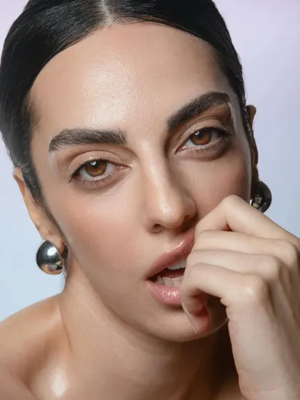 Another close-up from the same series, this time with a focus on the glossy lip and the flawless skin texture.