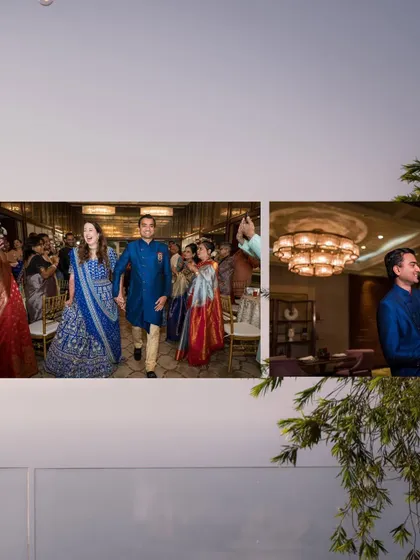 The couple making their entrance at the reception, hand-in-hand, with smiling faces.