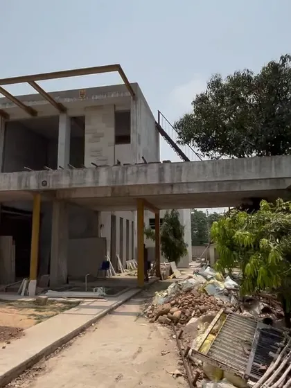 Another construction site image from the Jammu project, showing the scale of the structure and the raw form of the cantilevered sections. This highlights the engineering and architectural work behind the finished design.