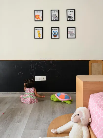 The completed daughter's room, featuring a fun and functional chalkboard wall for endless creativity.