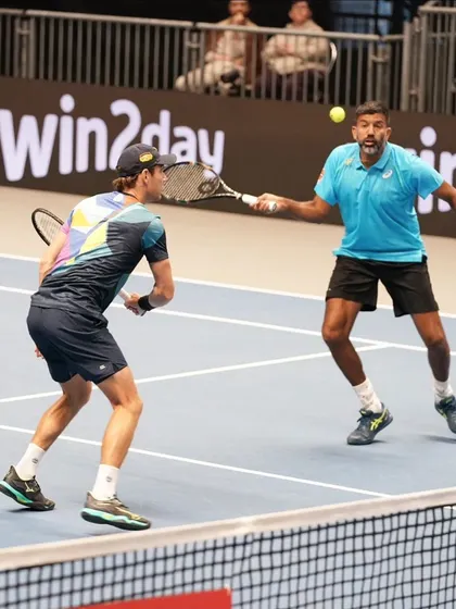 A reflex volley in a fast-paced doubles exchange.