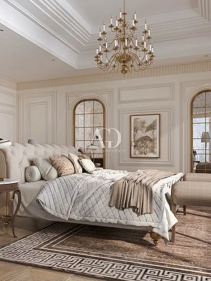 Timeless elegance is the theme of this bedroom, which features a beautifully upholstered bed and classic furniture. The arched, mirrored panels on the wall add depth and reflect light, making the space feel larger and more grand.