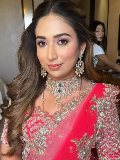A close-up of her soft, elegant, and timeless makeup, featuring pink tones on the eyes.