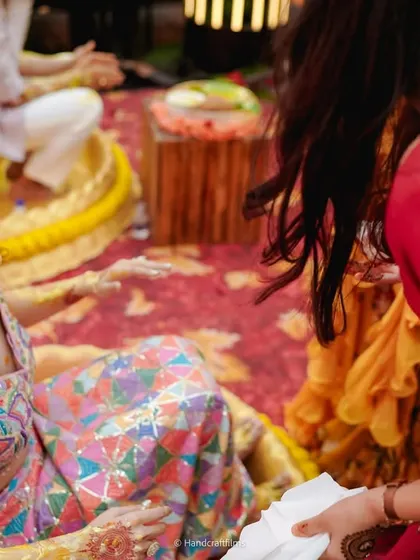 The bride enjoying the rituals with her family and friends.
